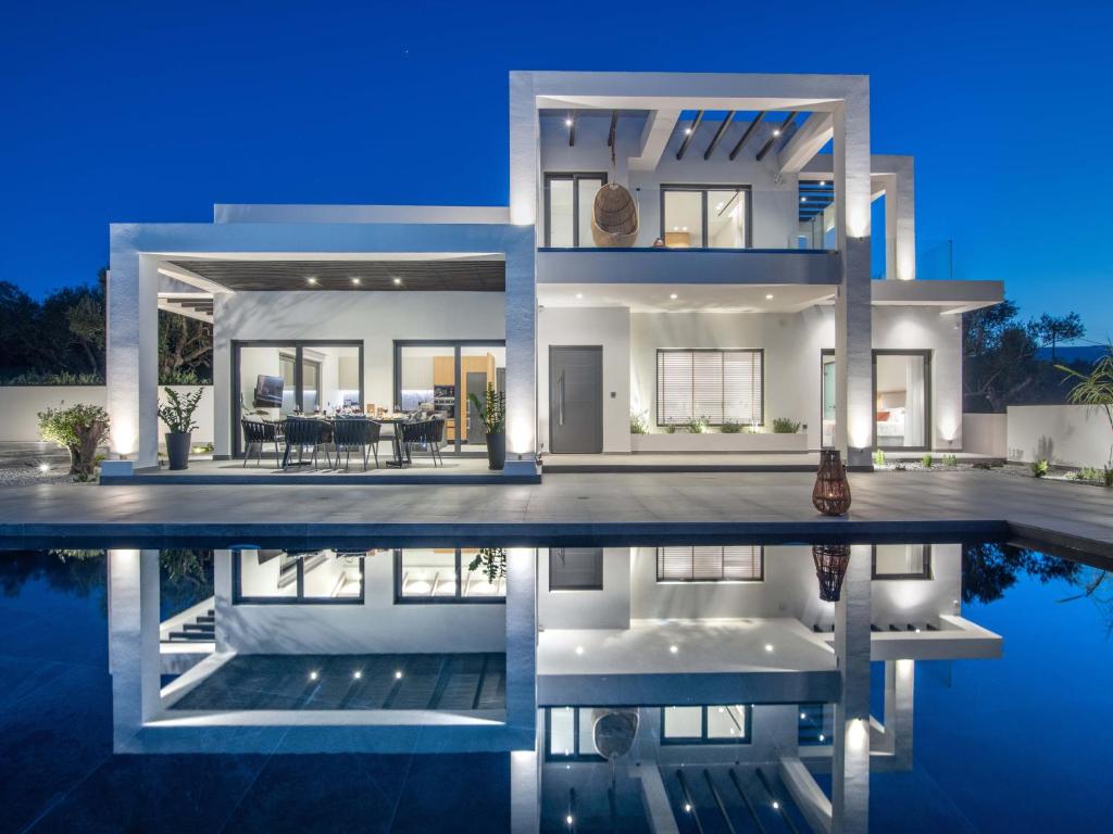 Modern smart home exterior with evening lighting